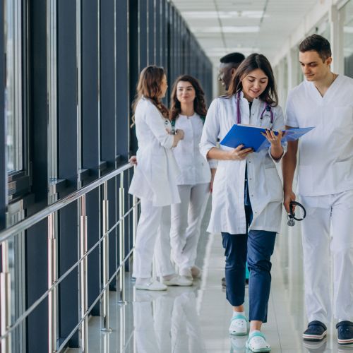 Team young specialist doctors standing corridor hospital